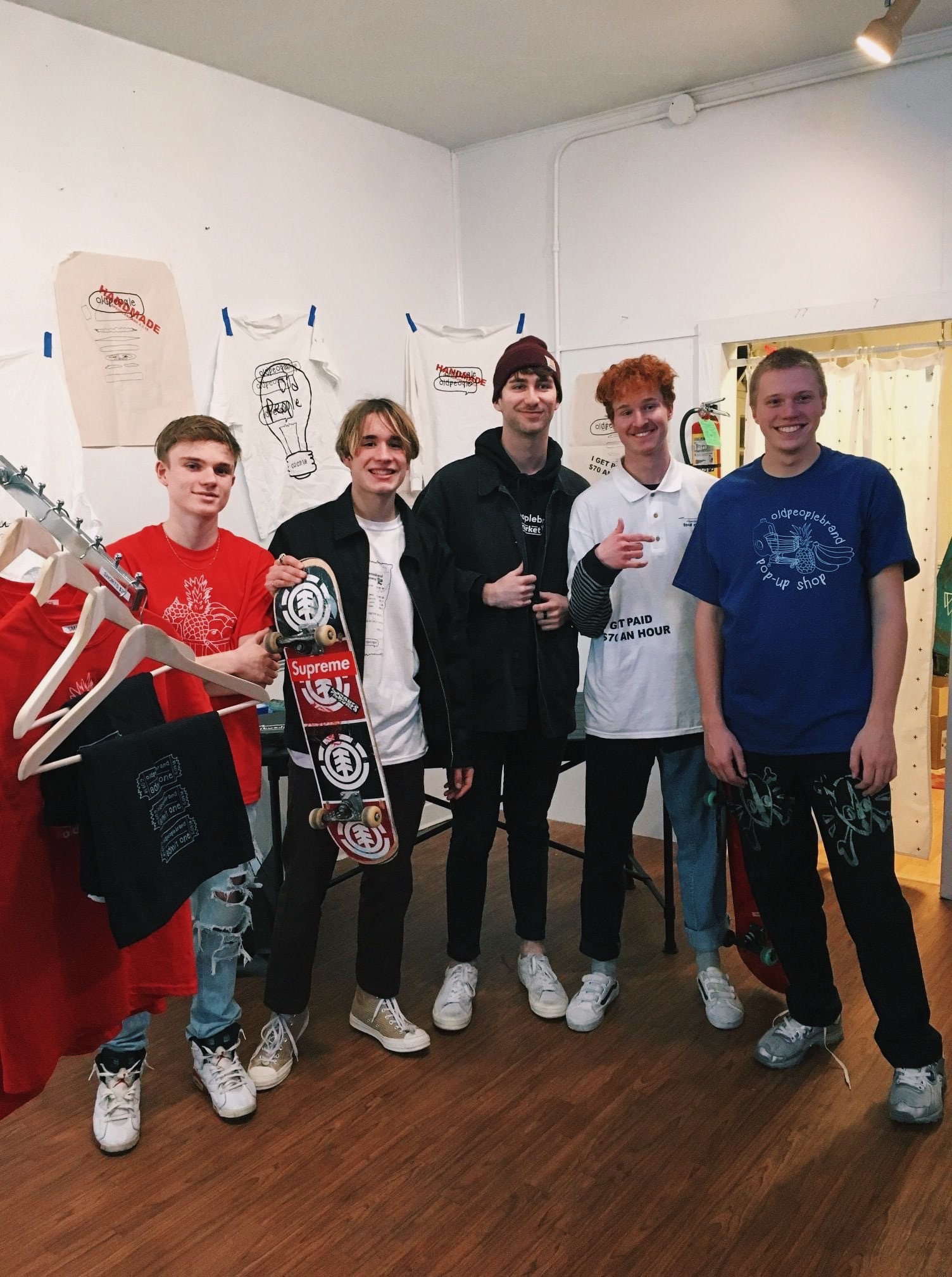 Team members of Old People Brand at their pop up shop. 