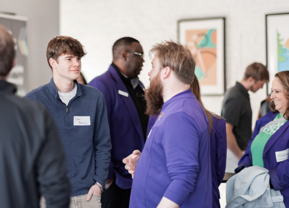 Students networking with business professionals at Business Breakthrough